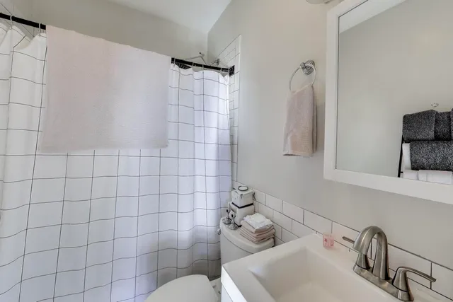 a bathroom with a sink and mirror