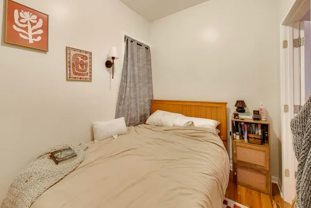 a bedroom with a bed and a table