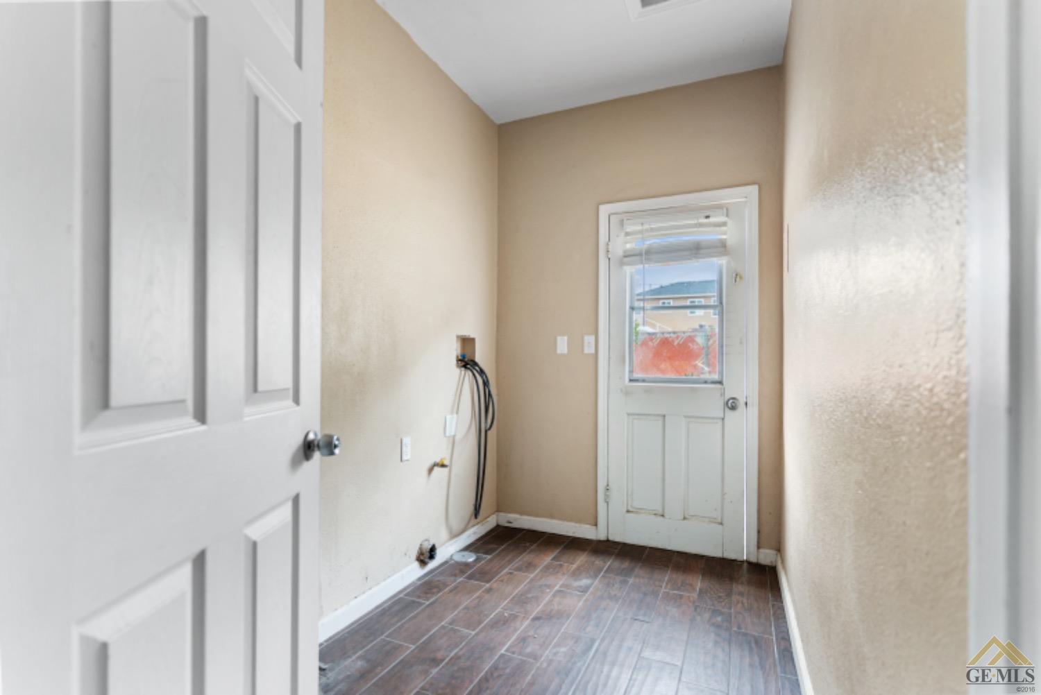 Undisclosed Address Taft, CA 93268 - Photo 12 of 17 a view of a hallway with wooden floor and closet