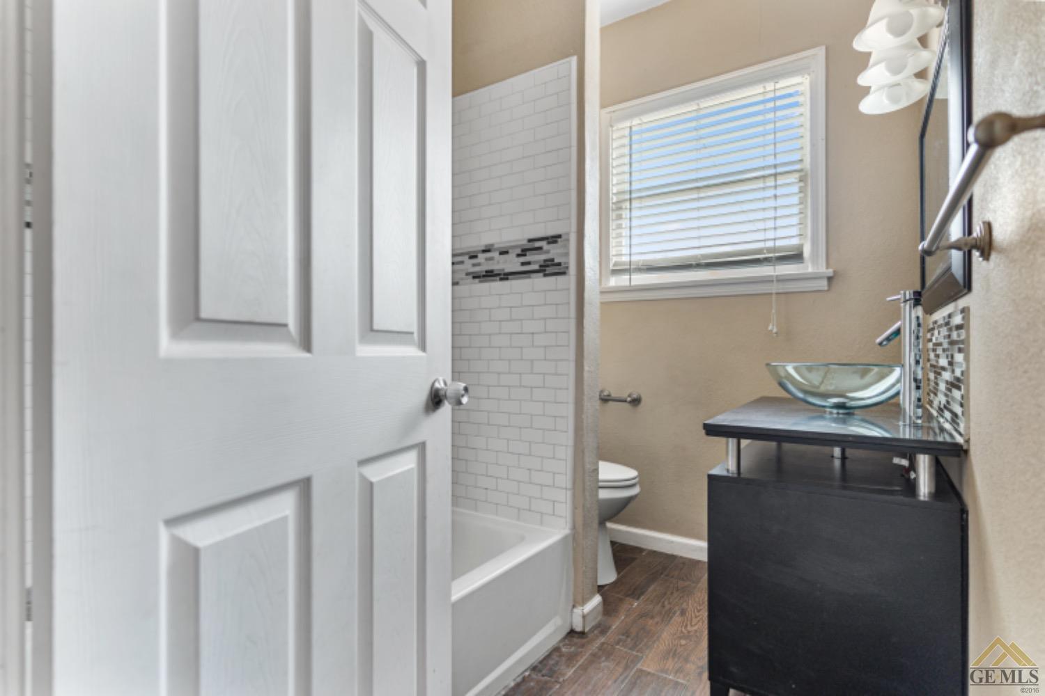 Undisclosed Address Taft, CA 93268 - Photo 15 of 17 a bathroom with a bathtub and a sink