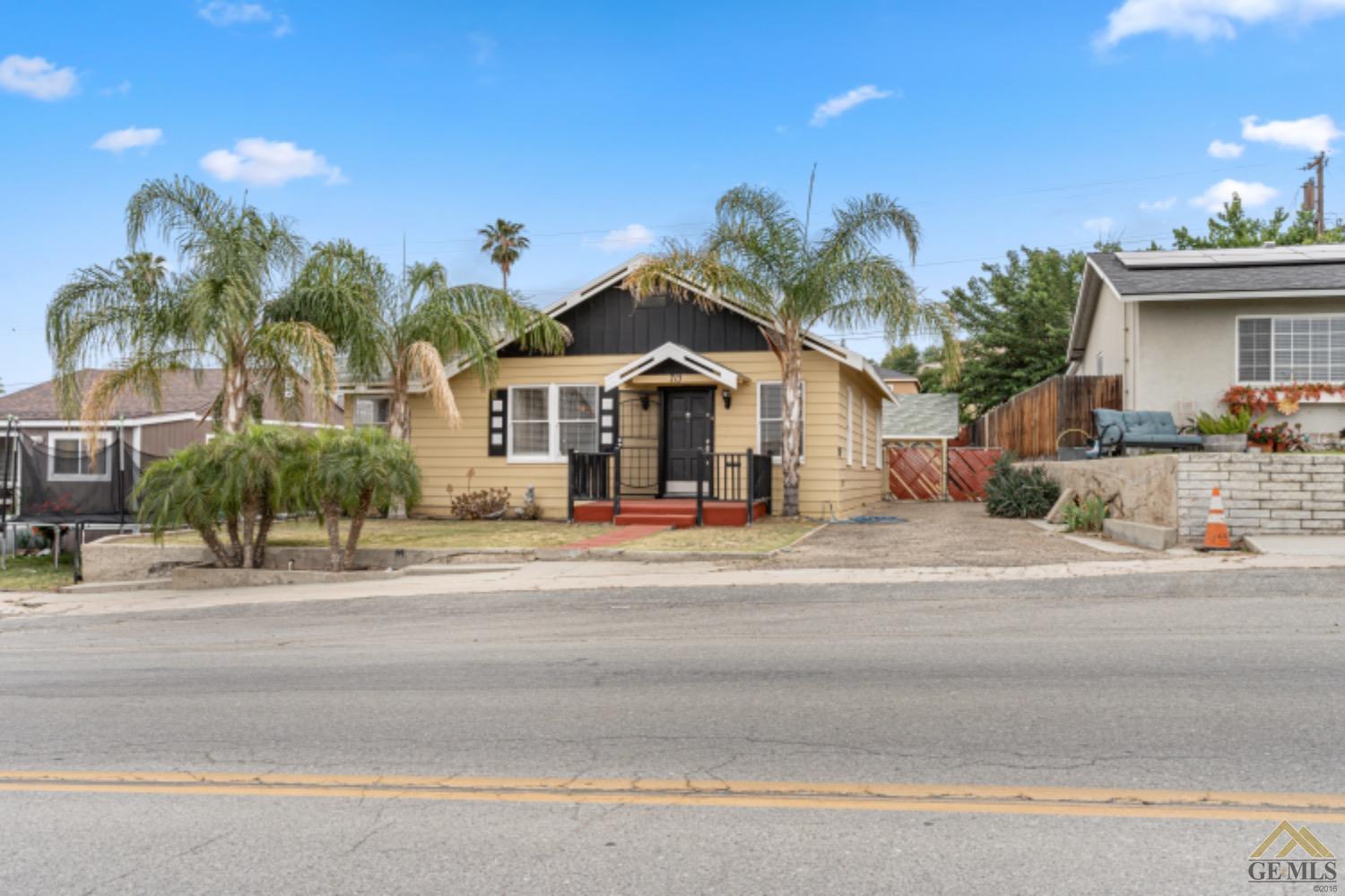 Undisclosed Address Taft, CA 93268 - Photo 2 of 17 a front view of a house with a yard