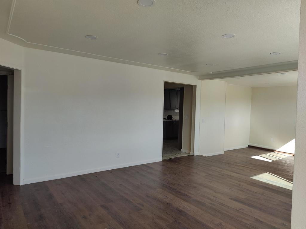 5382 Bonita Drive San Diego, CA 92114 - Photo 15 of 15 a view of an empty room with wooden floor