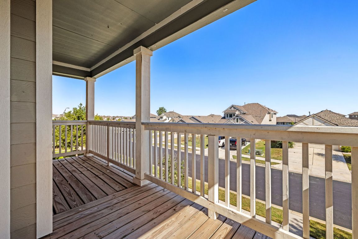 321 Arabian Colt Drive Georgetown, TX 78626 - Photo 16 of 24 a view of a balcony with wooden floor