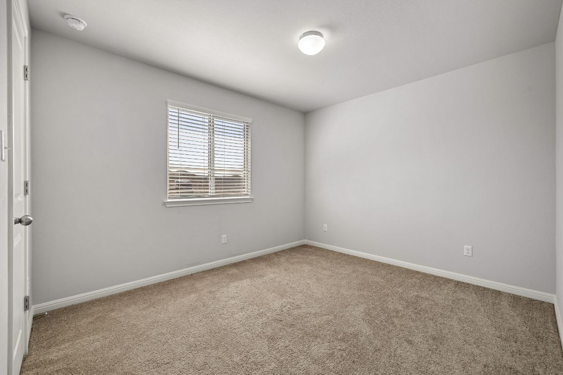 321 Arabian Colt Drive Georgetown, TX 78626 - Photo 17 of 24 an empty room with a window