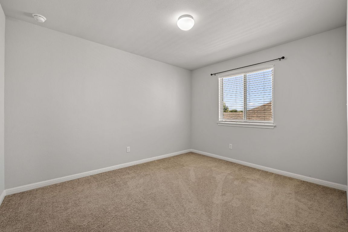 321 Arabian Colt Drive Georgetown, TX 78626 - Photo 19 of 24 an empty room with a window
