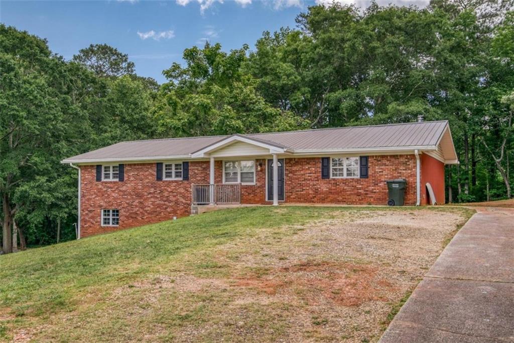 1673 Snows Mill Road Monroe, GA 30655 - Photo 1 of 1 front view of a house with a yard