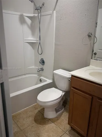 a bathroom with a toilet and a bathtub