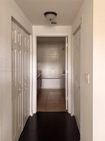 a view of hallway with door