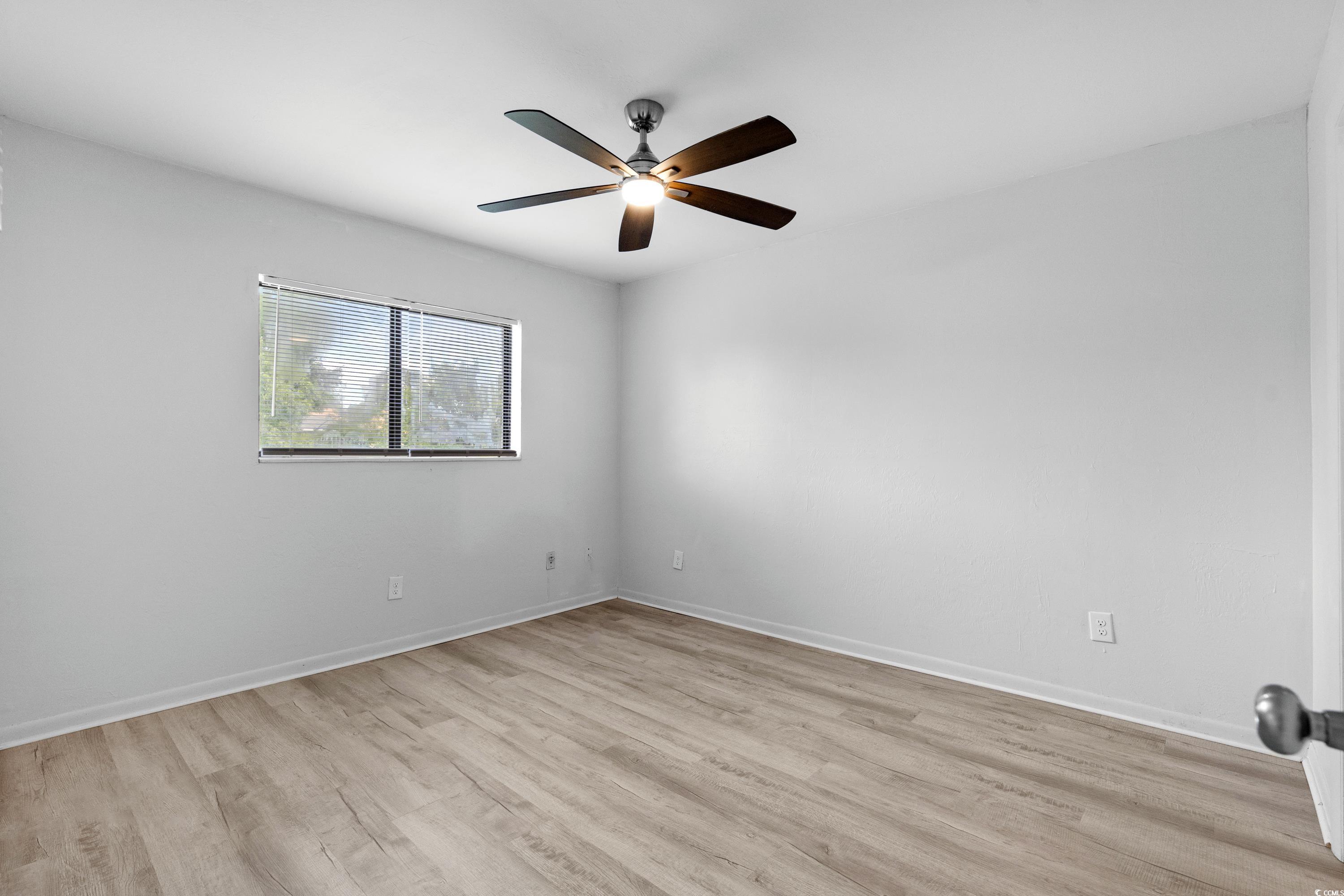 1301 Pridgen Road, Unit 1008 Myrtle Beach, SC 29577 - Photo 12 of 23 Empty room featuring light hardwood / wood-style f