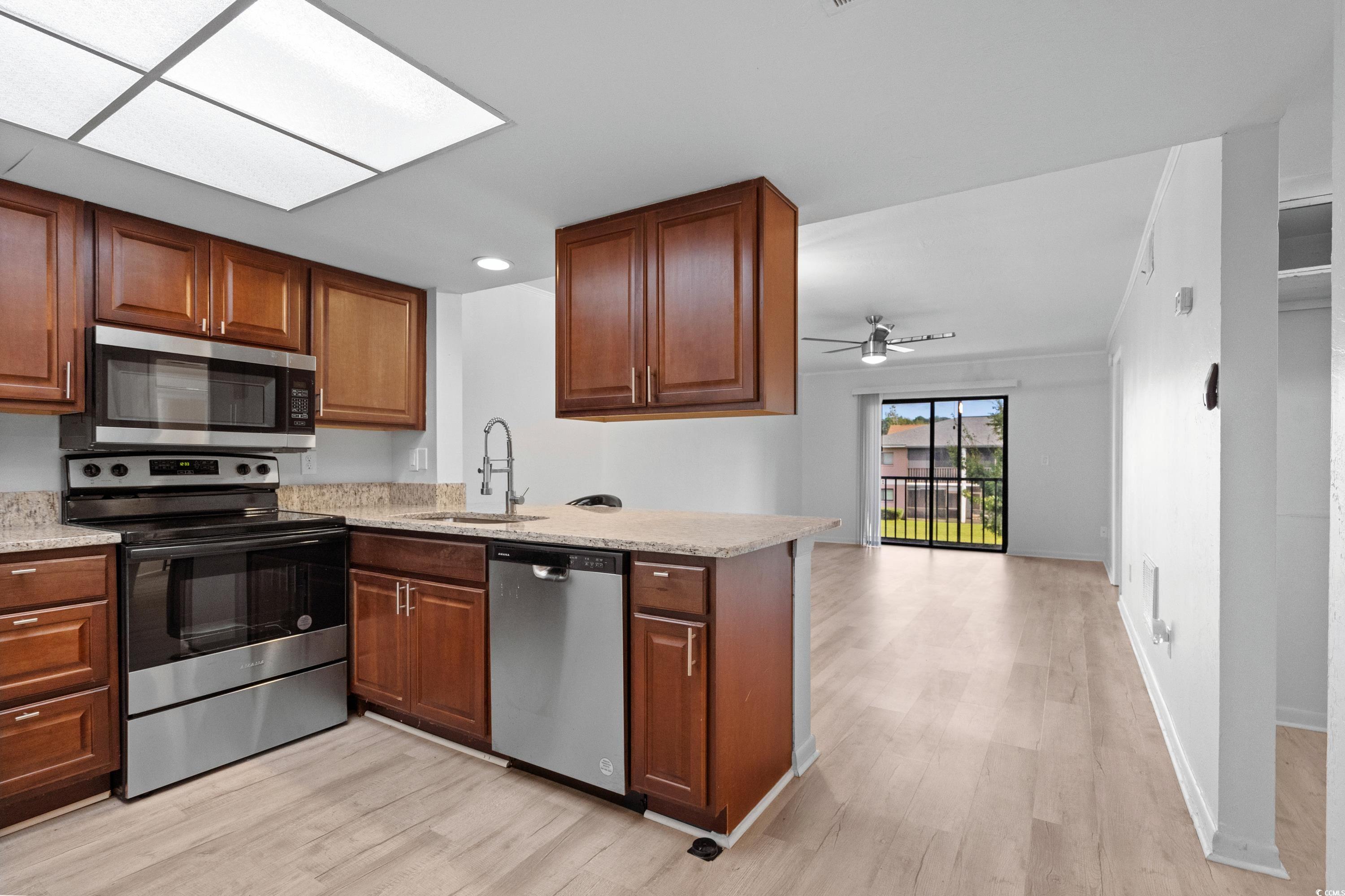 1301 Pridgen Road, Unit 1008 Myrtle Beach, SC 29577 - Photo 3 of 23 Kitchen with ceiling fan, sink, kitchen peninsula,