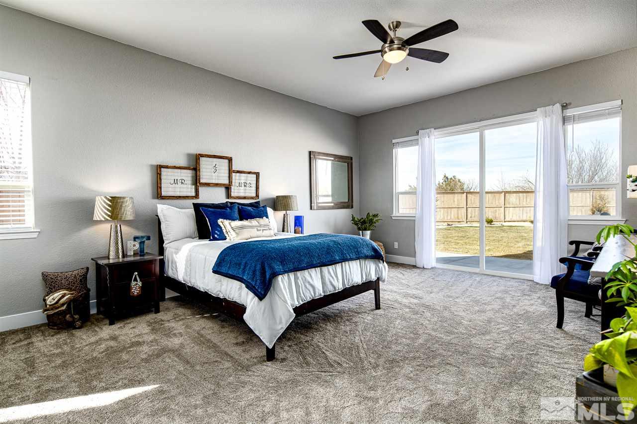 10535 Autumn Walk Court Reno, NV 89521 - Photo 11 of 25 a bedroom with a bed and a large window