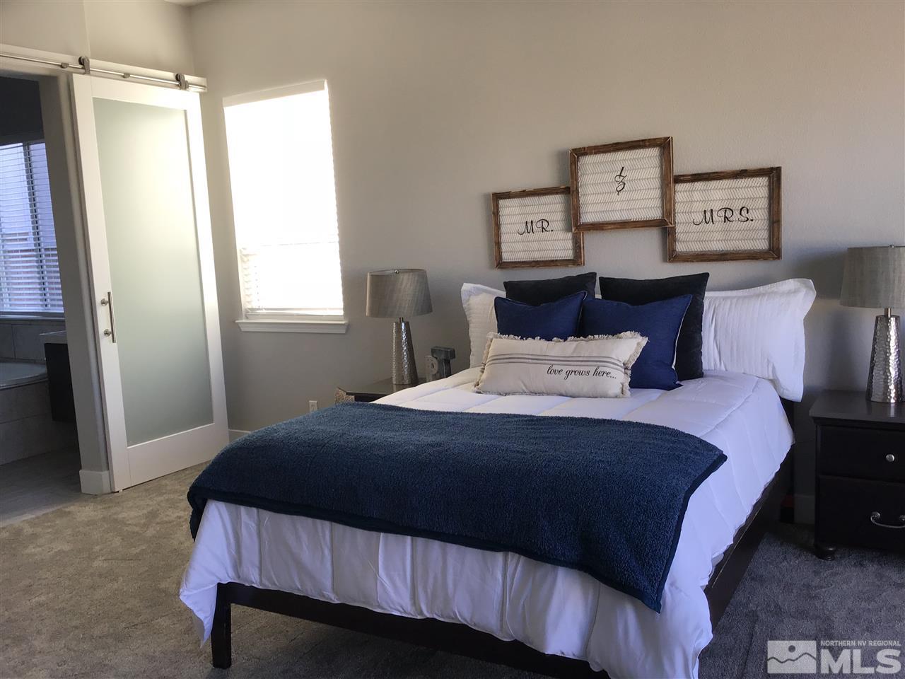 10535 Autumn Walk Court Reno, NV 89521 - Photo 12 of 25 a bedroom with a bed and a window