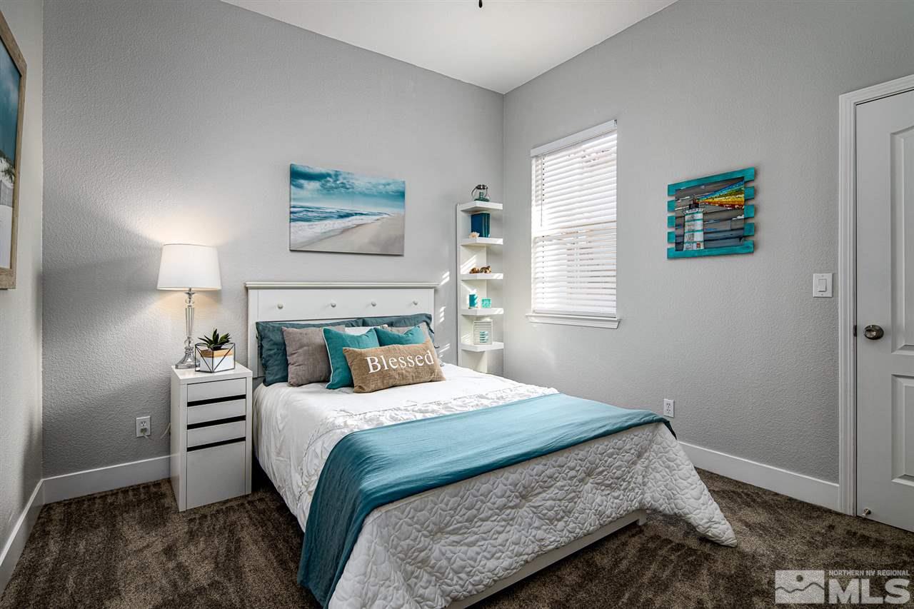 10535 Autumn Walk Court Reno, NV 89521 - Photo 14 of 25 a bedroom with a bed and a window