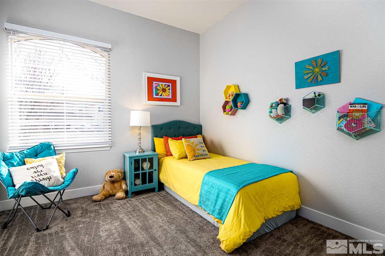 10535 Autumn Walk Court Reno, NV 89521 - Photo 15 of 25 a bedroom with a bed and a couch