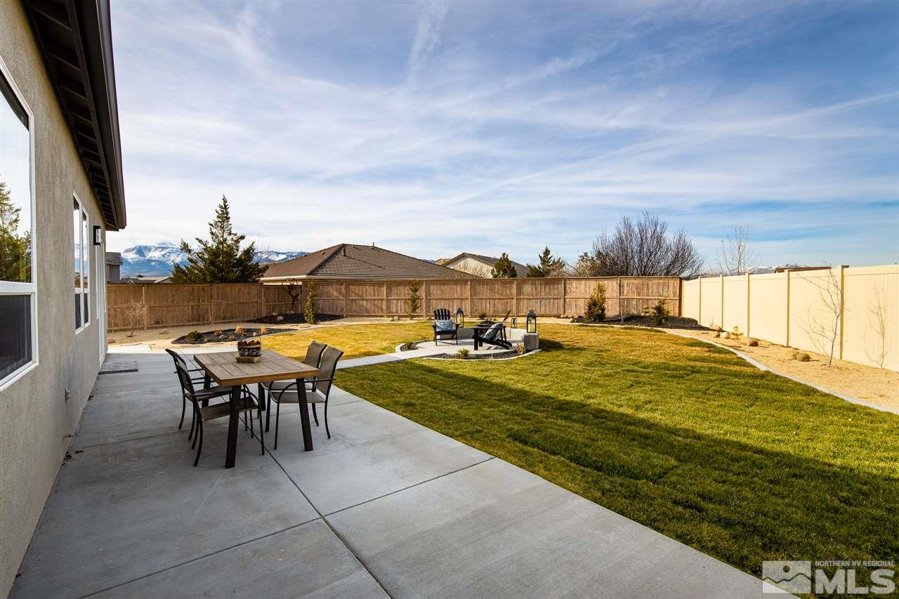 10535 Autumn Walk Court Reno, NV 89521 - Photo 23 of 25 a view of a patio with table and chairs and potted plants