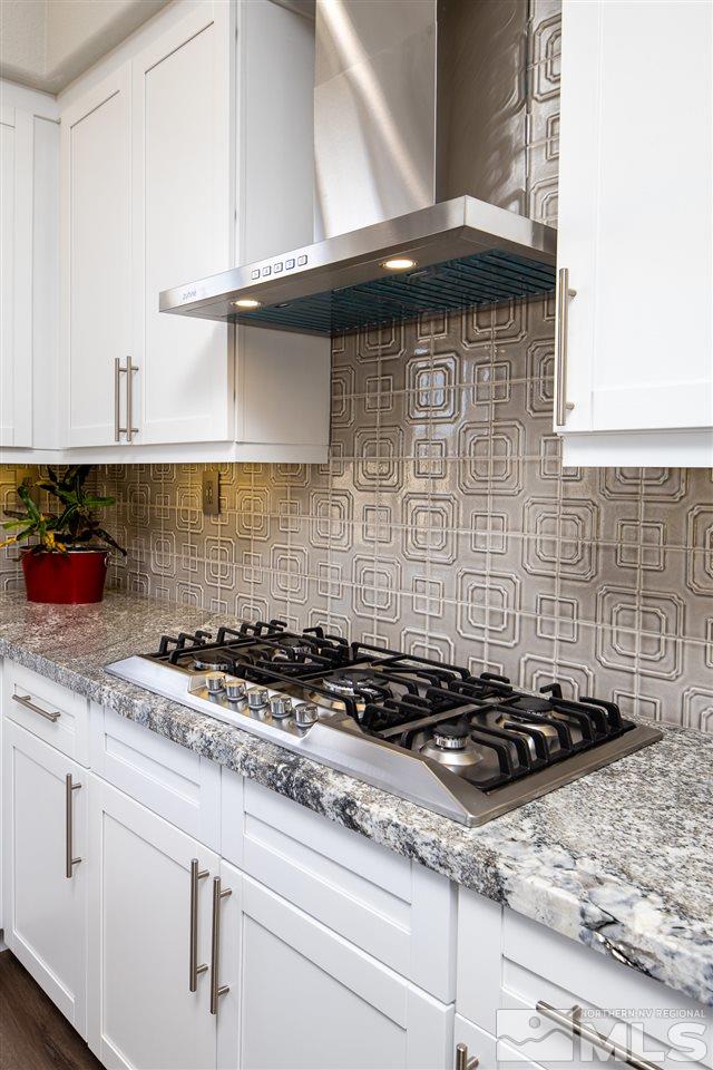 10535 Autumn Walk Court Reno, NV 89521 - Photo 4 of 25 a close view of a stove a sink and dishwasher in a kitchen