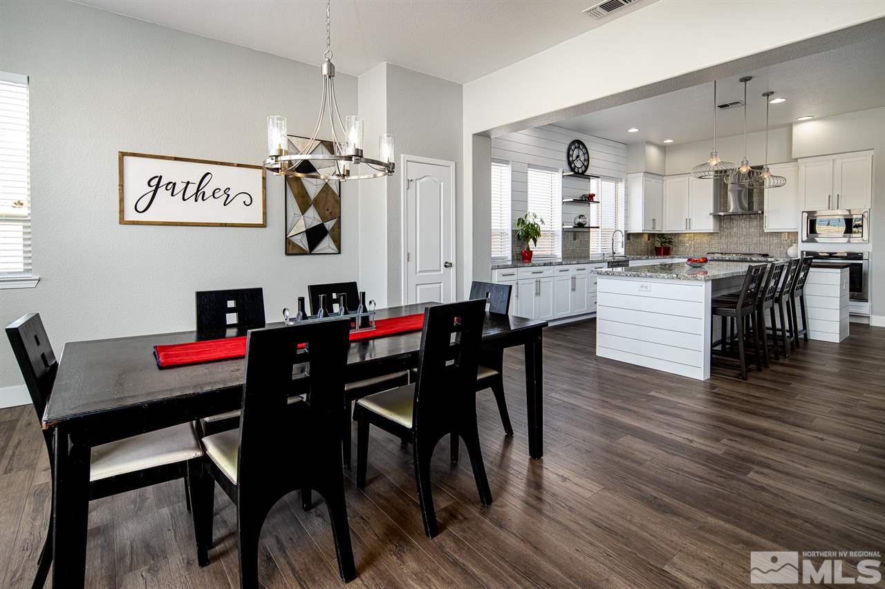 10535 Autumn Walk Court Reno, NV 89521 - Photo 5 of 25 a view of a dining room with furniture and wooden floor
