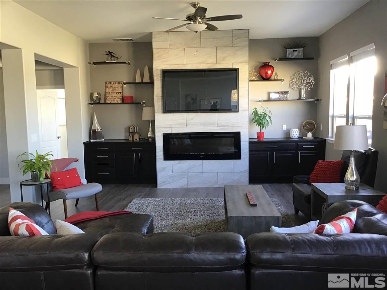 10535 Autumn Walk Court Reno, NV 89521 - Photo 7 of 25 a living room with furniture and a fireplace