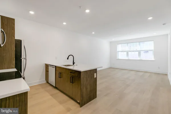 a view of a storage & utility room with windows