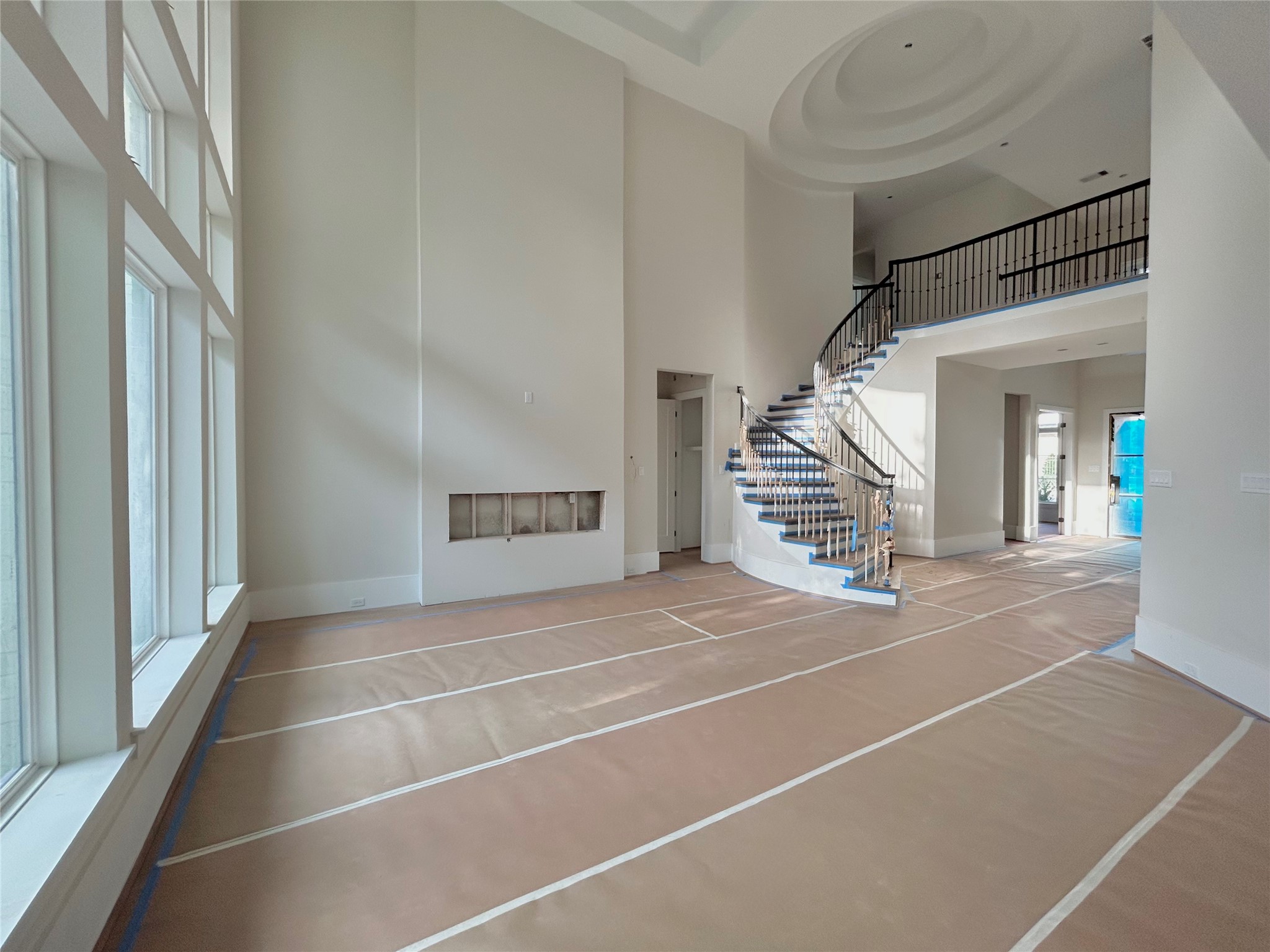 1306 Zora Street Houston, TX 77055 - Photo 5 of 25 Open Concept Living Area with Tons of Natural Light, High Ceilings, and Featuring An Electric Fireplace. Construction Photo as of 4/16/2026