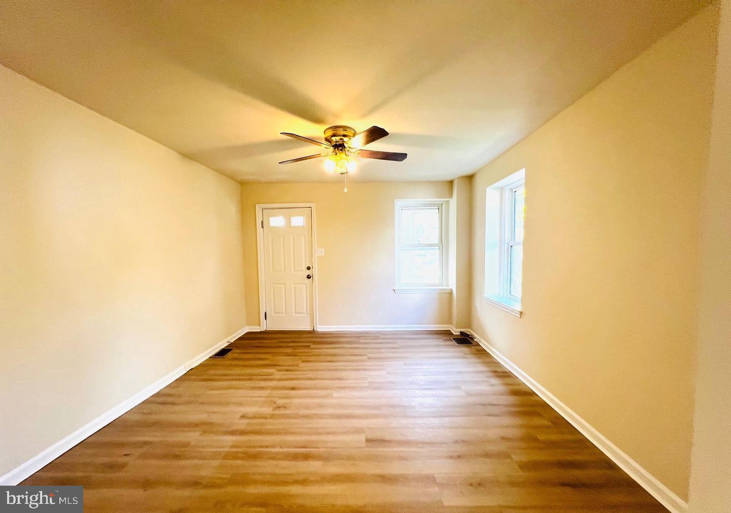 617 3rd Street Beverly, NJ 08010 - Photo 7 of 16 a view of an empty room with window and a ceiling fan