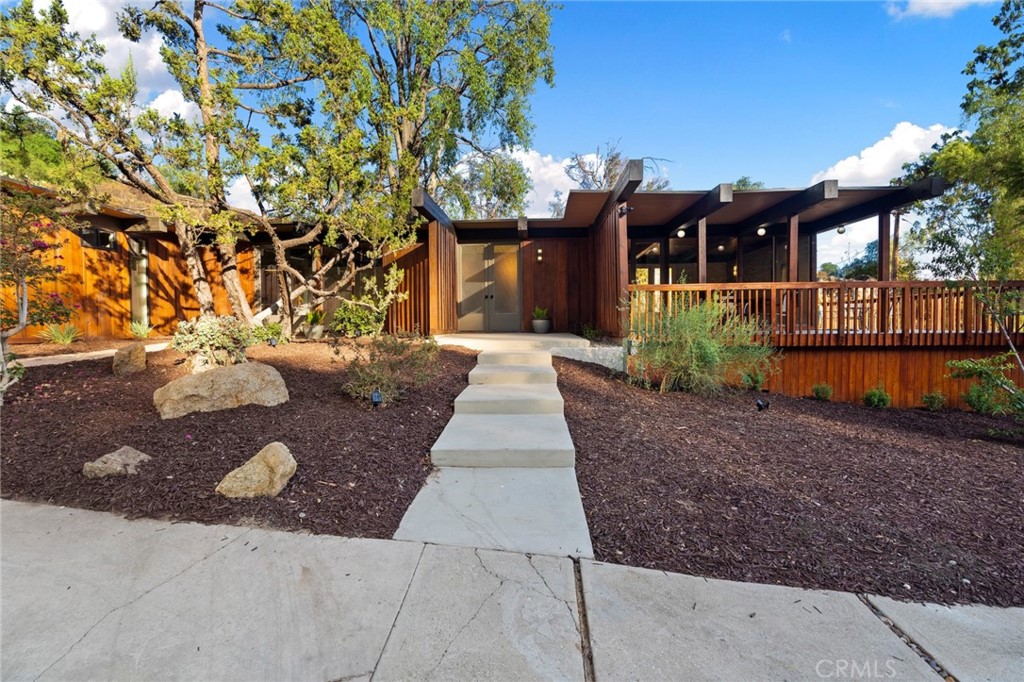 4084 Miramonte Place Riverside, CA 92501 - Photo 11 of 60 a front view of a house with a yard