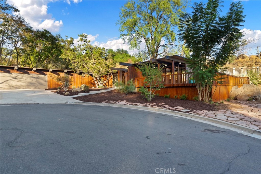 4084 Miramonte Place Riverside, CA 92501 - Photo 12 of 60 a front view of a house with a yard and garage