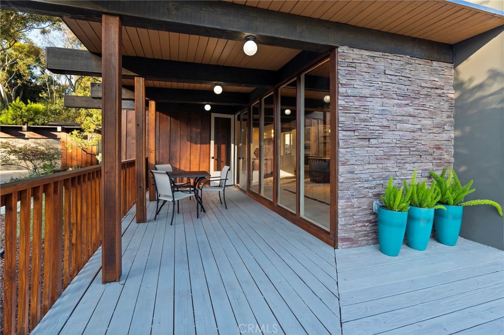 4084 Miramonte Place Riverside, CA 92501 - Photo 18 of 60 a view of a balcony with chairs and wooden floor