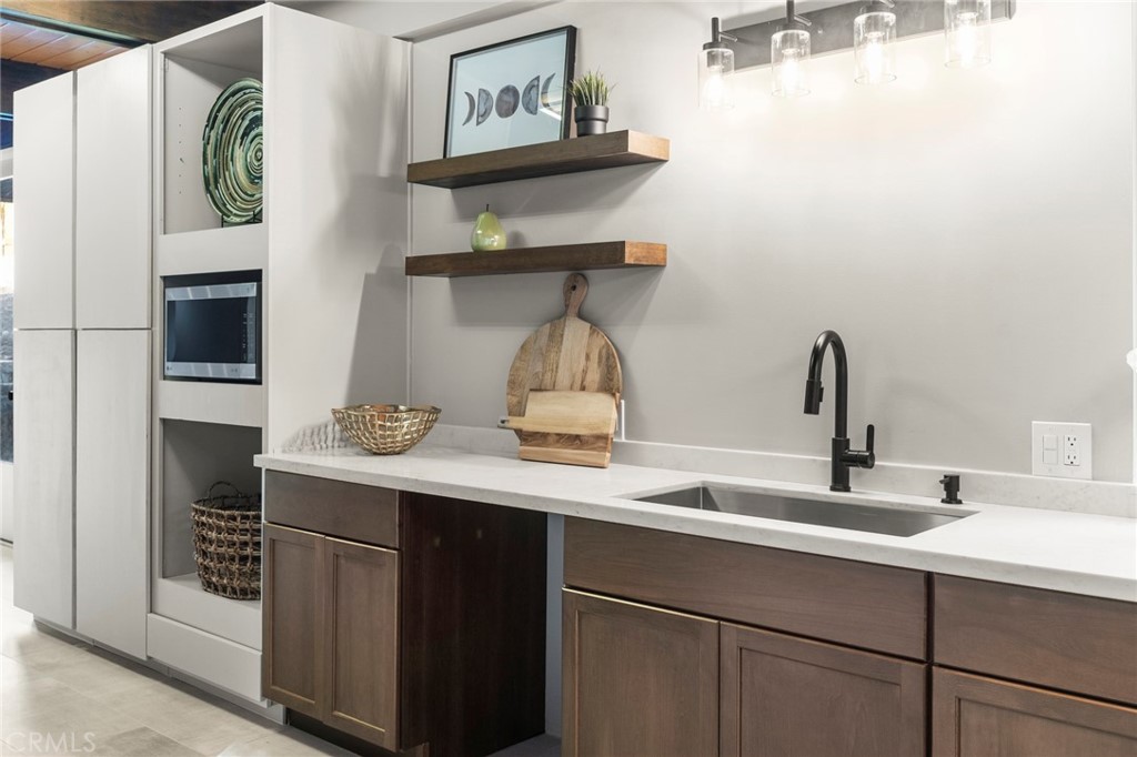 4084 Miramonte Place Riverside, CA 92501 - Photo 27 of 60 a kitchen with a sink and cabinets