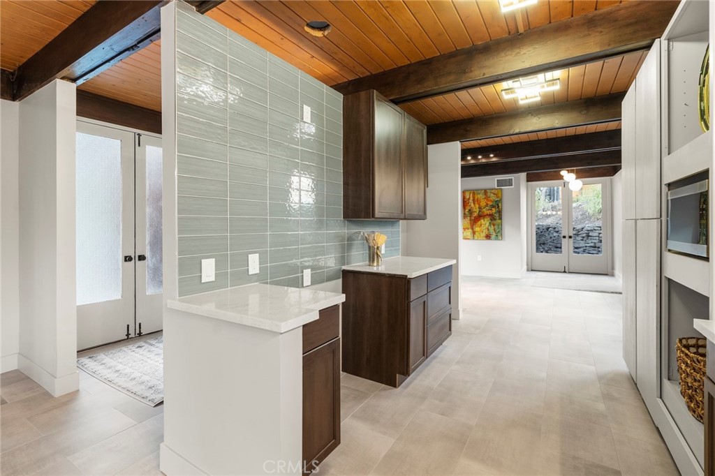 4084 Miramonte Place Riverside, CA 92501 - Photo 28 of 60 a large kitchen with stainless steel appliances granite countertop a sink and a stove