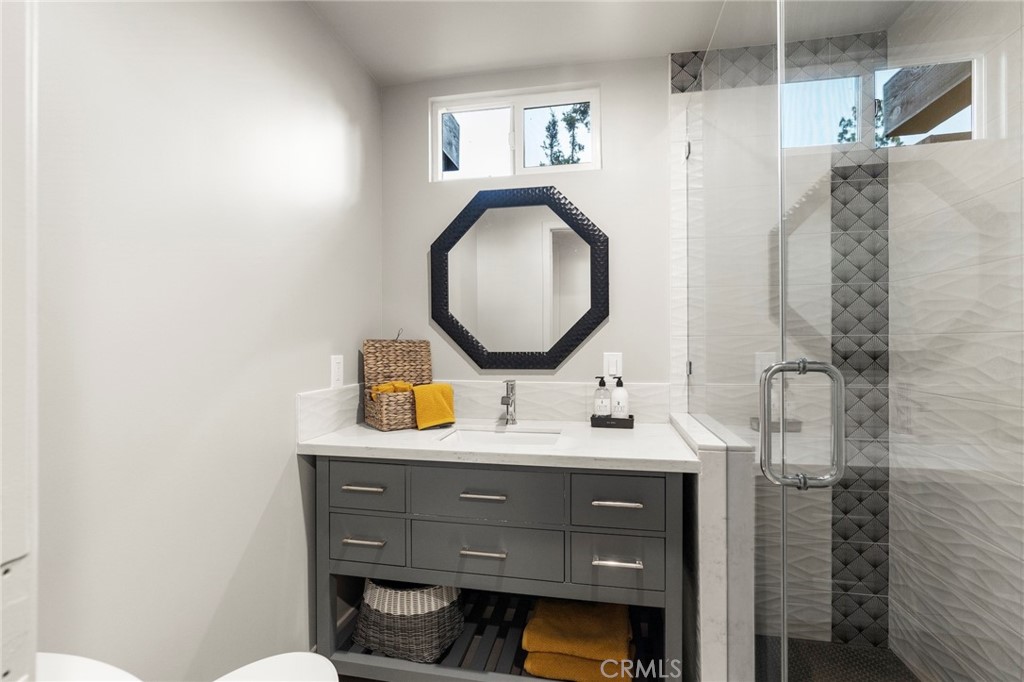 4084 Miramonte Place Riverside, CA 92501 - Photo 38 of 60 a bathroom with a sink mirror and vanity