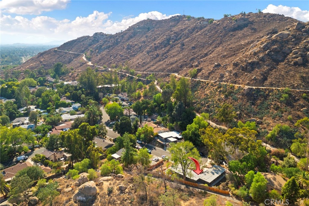 4084 Miramonte Place Riverside, CA 92501 - Photo 53 of 60 a view of a houses with a lush green hillside