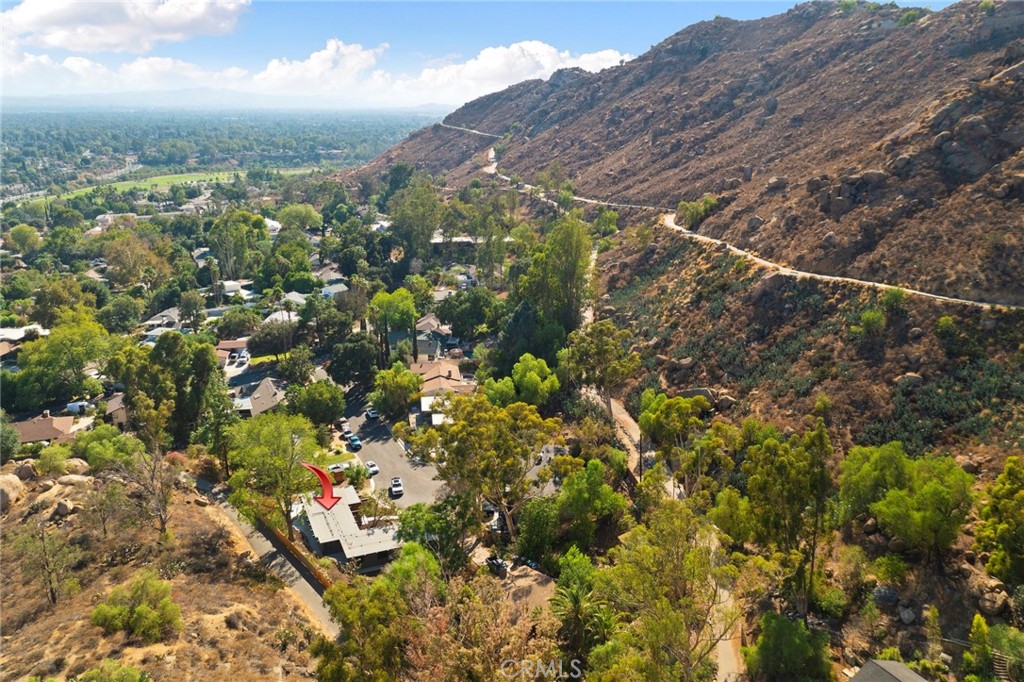 4084 Miramonte Place Riverside, CA 92501 - Photo 54 of 60 a view of a houses with a lush green hillside
