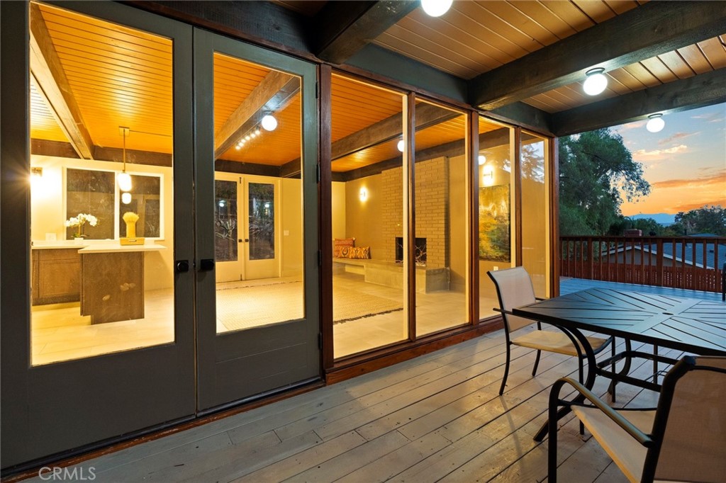 4084 Miramonte Place Riverside, CA 92501 - Photo 7 of 60 a view of a porch with furniture and wooden floor