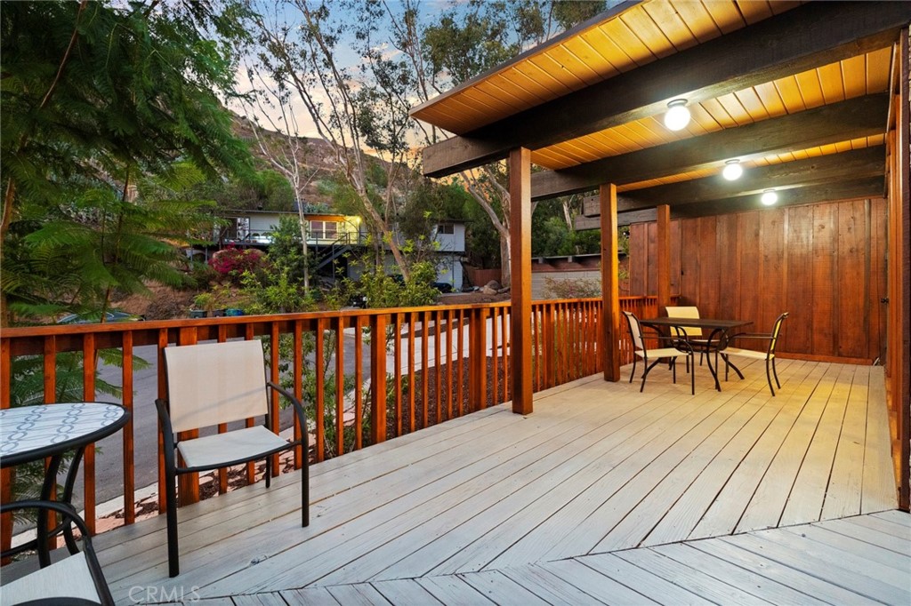 4084 Miramonte Place Riverside, CA 92501 - Photo 8 of 60 a view of a chairs and table on the wooden deck