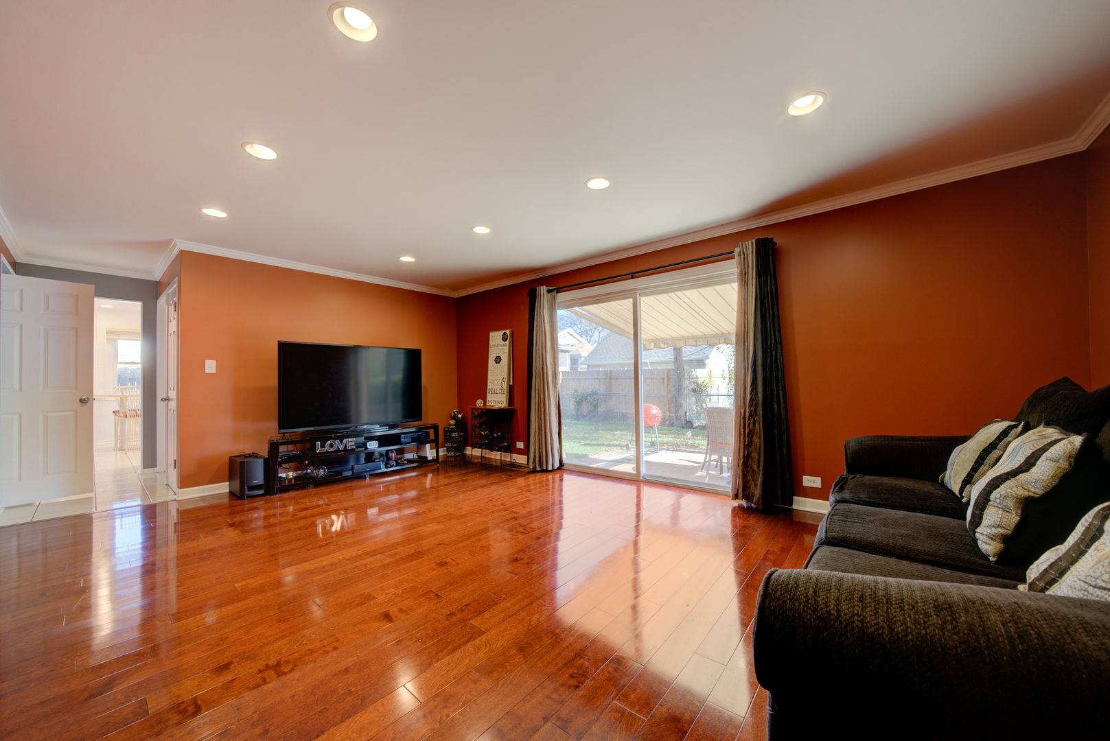 9211 Washington Road Morton Grove, IL 60053 - Photo 11 of 29 a living room with furniture and a flat screen tv
