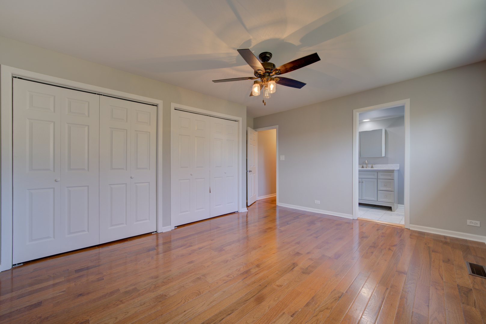 9211 Washington Road Morton Grove, IL 60053 - Photo 16 of 29 a view of an empty room with wooden floor