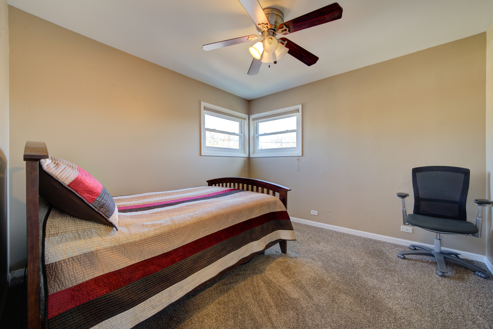 9211 Washington Road Morton Grove, IL 60053 - Photo 20 of 29 a bedroom with a bed and a ceiling fan