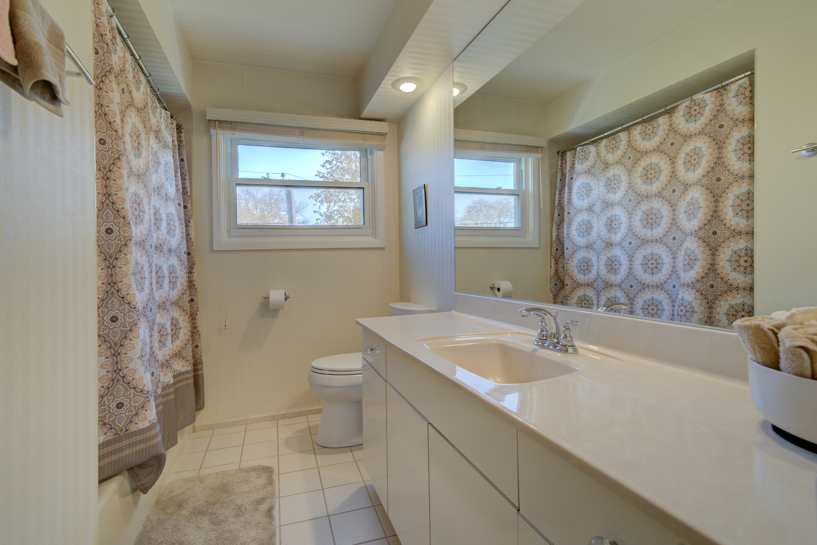 9211 Washington Road Morton Grove, IL 60053 - Photo 21 of 29 a bathroom with a sink a toilet and a tub