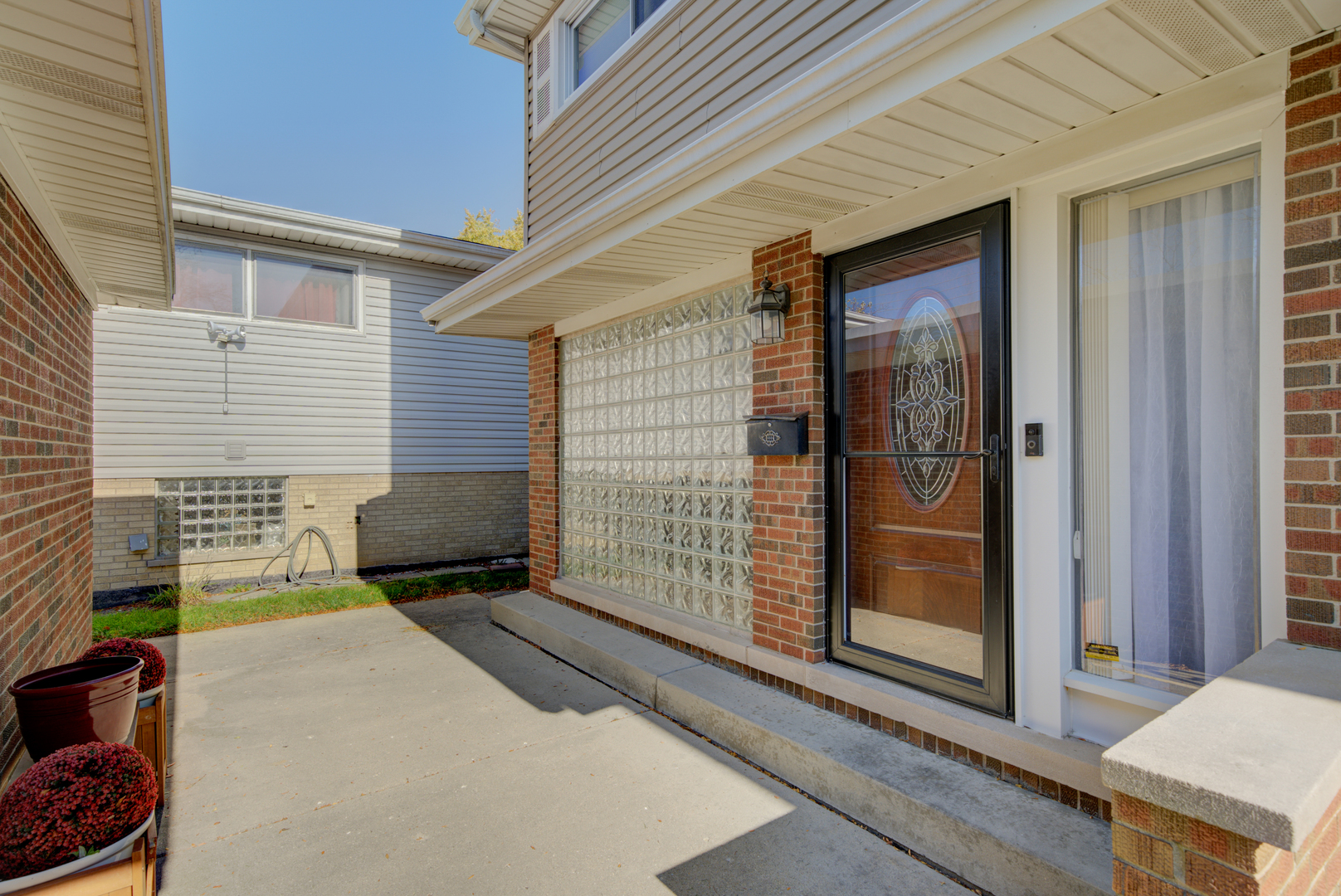 9211 Washington Road Morton Grove, IL 60053 - Photo 3 of 29 a brick house with a outdoor space