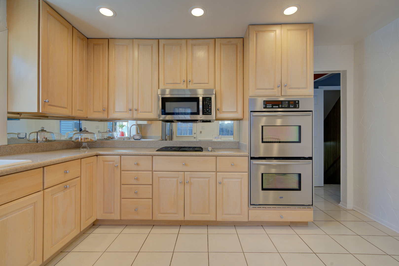 9211 Washington Road Morton Grove, IL 60053 - Photo 7 of 29 a kitchen with cabinets appliances and a sink