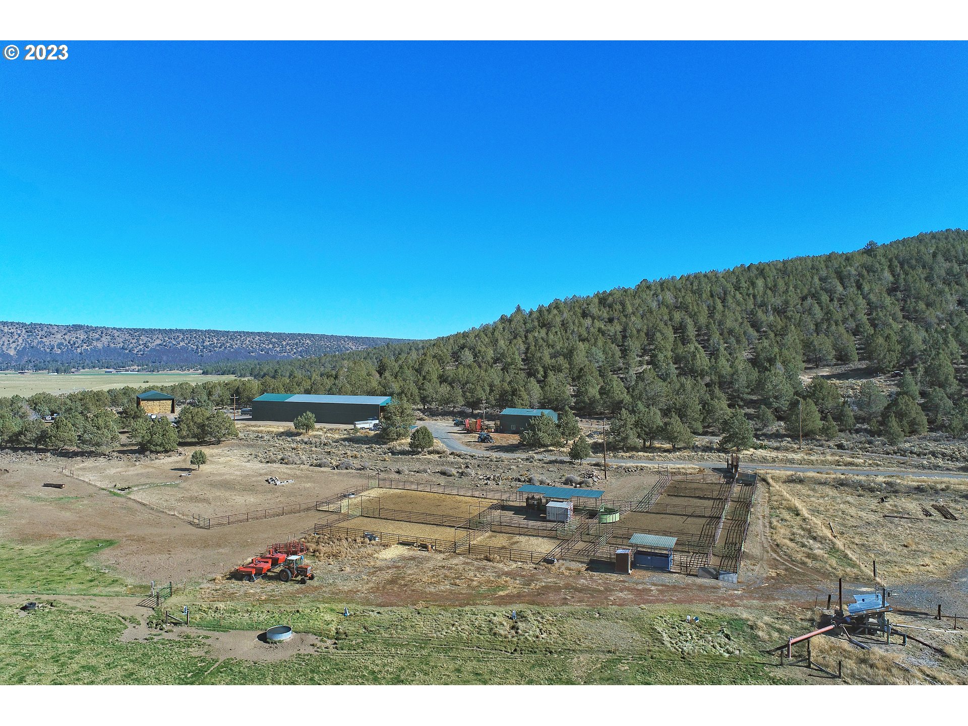 Mitchell Road Dairy, OR 97625 - Photo 3 of 18 a view of a dry yard with trees