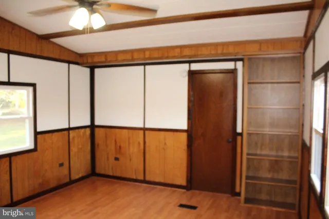 a bathroom with a window and a air conditioner