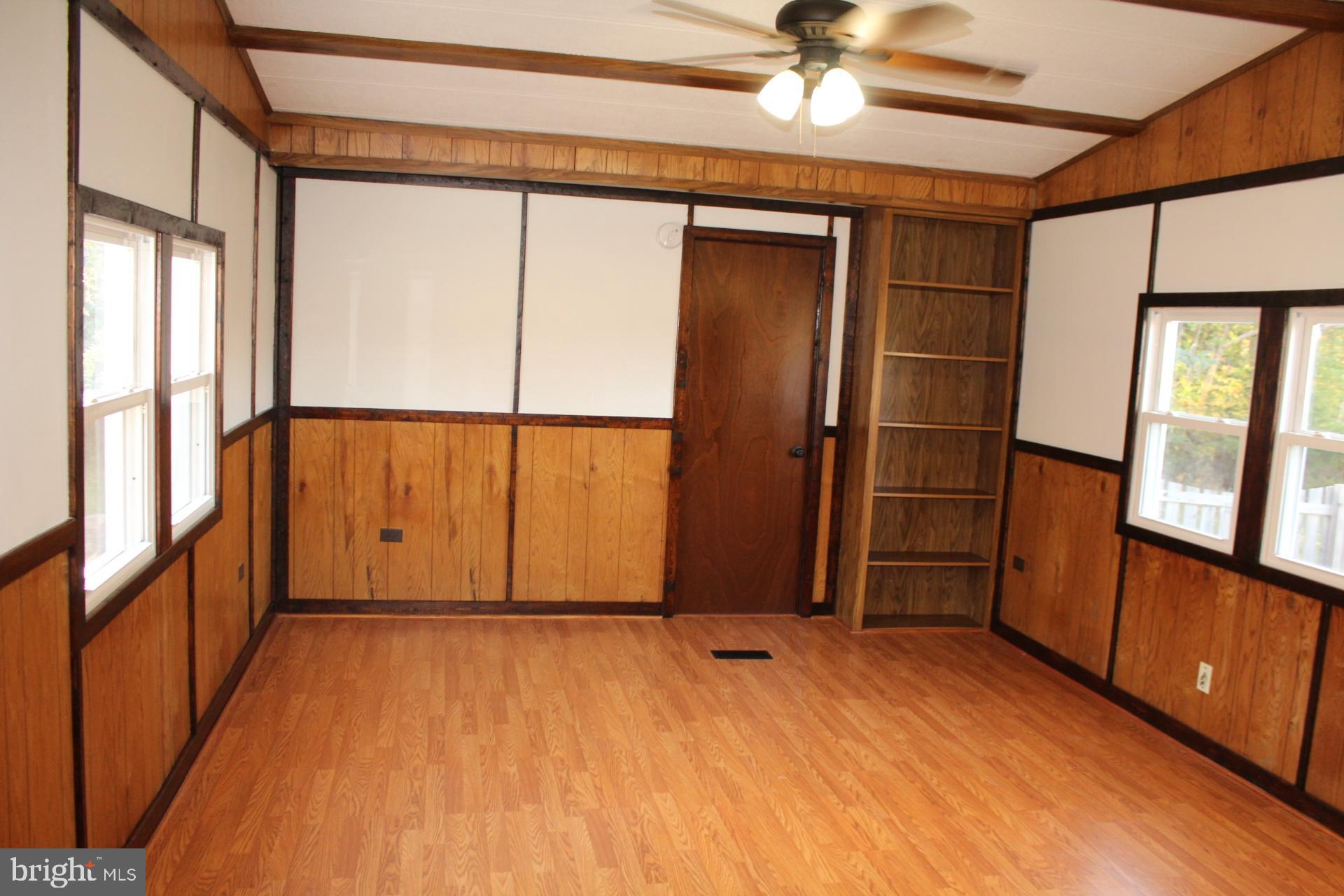 5274 Burr Hill Road Rhoadesville, VA 22542 - Photo 15 of 66 a view of an empty room with wooden floor and a window