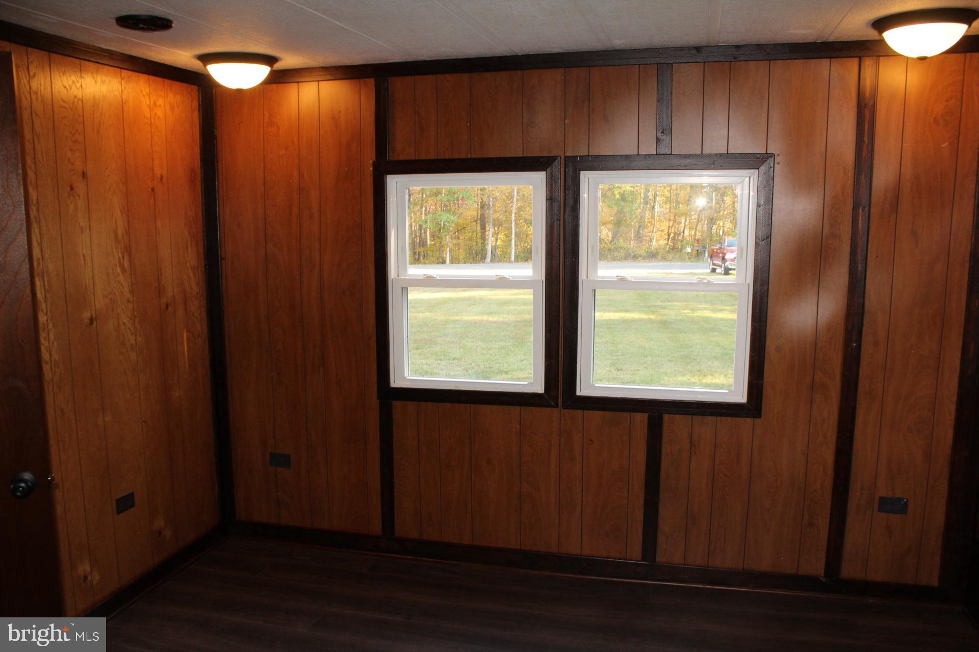 5274 Burr Hill Road Rhoadesville, VA 22542 - Photo 20 of 66 a view of an empty room with wooden floor and a window