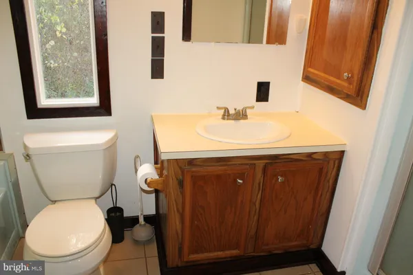 a kitchen with granite countertop a sink and a stove