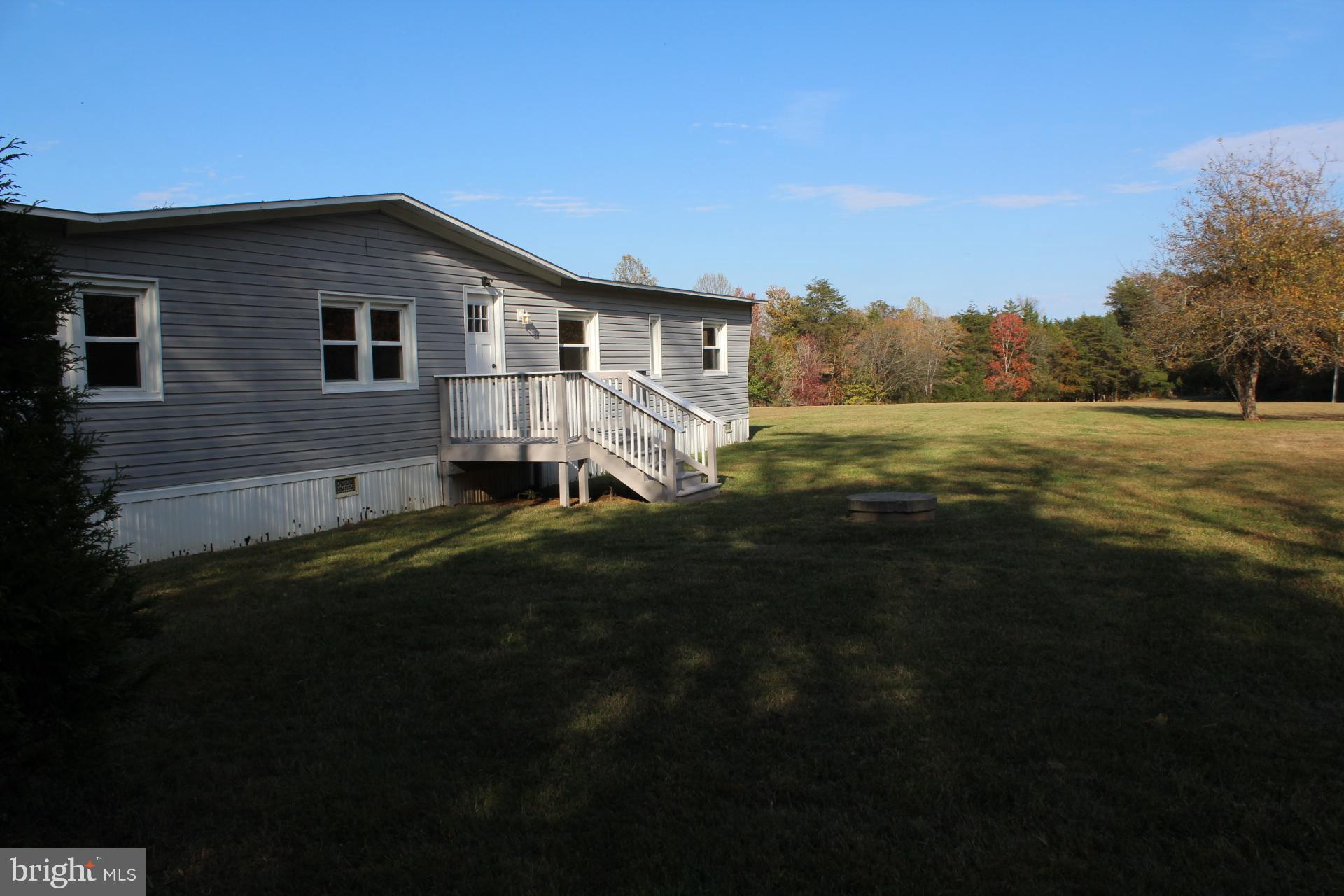 5274 Burr Hill Road Rhoadesville, VA 22542 - Photo 3 of 66 a view of a house with a yard