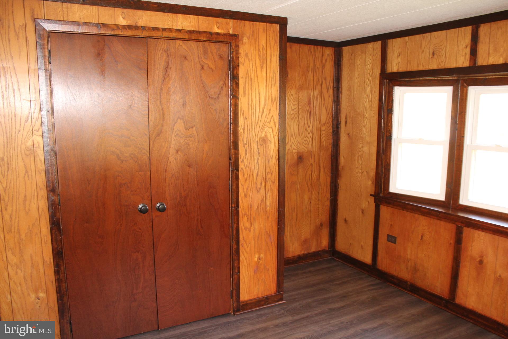 5274 Burr Hill Road Rhoadesville, VA 22542 - Photo 36 of 66 a view of an empty room with wooden floor and a window