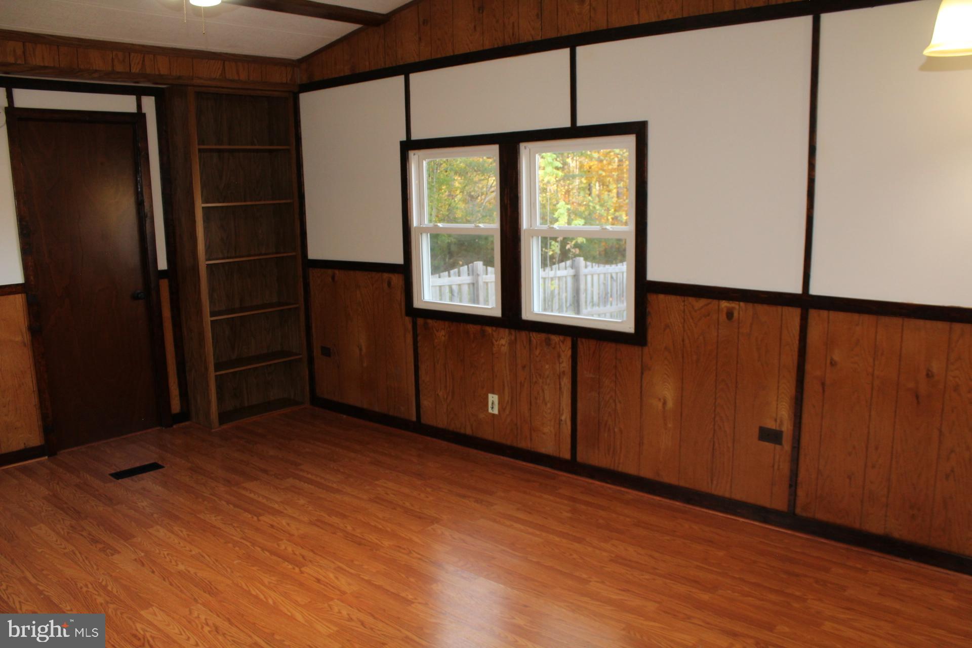 5274 Burr Hill Road Rhoadesville, VA 22542 - Photo 8 of 66 a view of an empty room with window and wooden floor