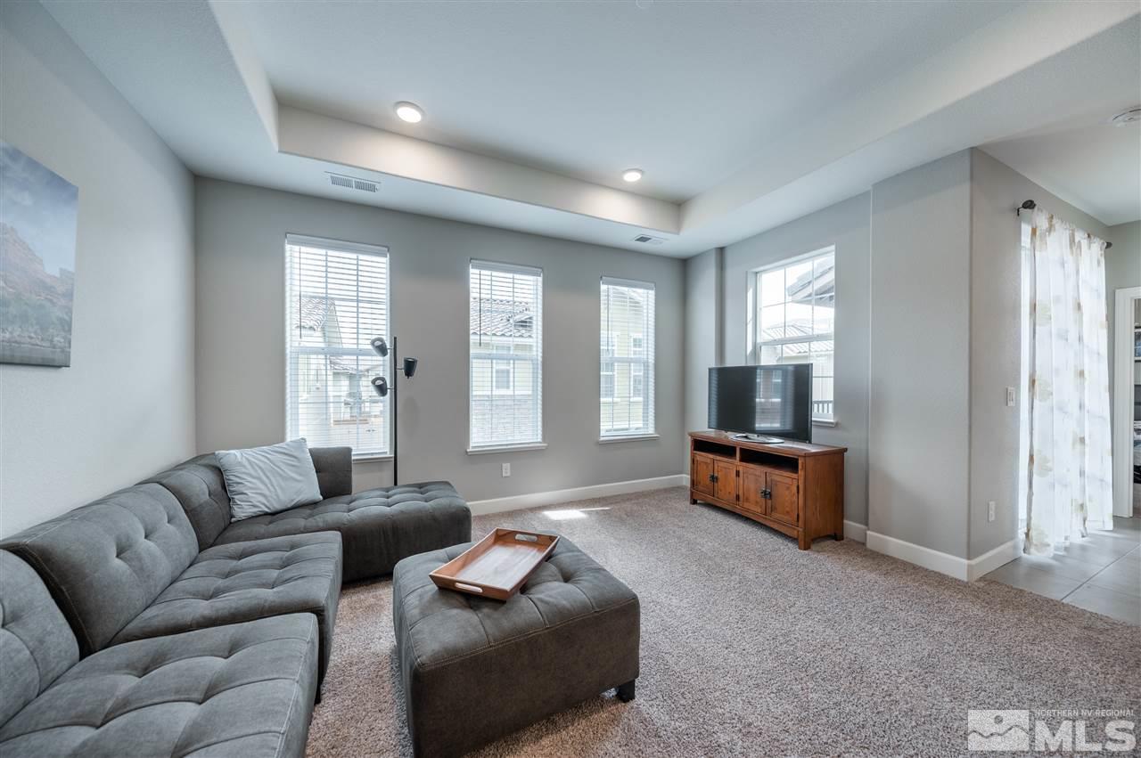1852 Sea Horse Road, Unit A Reno, NV 89521 - Photo 4 of 21 a living room with furniture and a flat screen tv